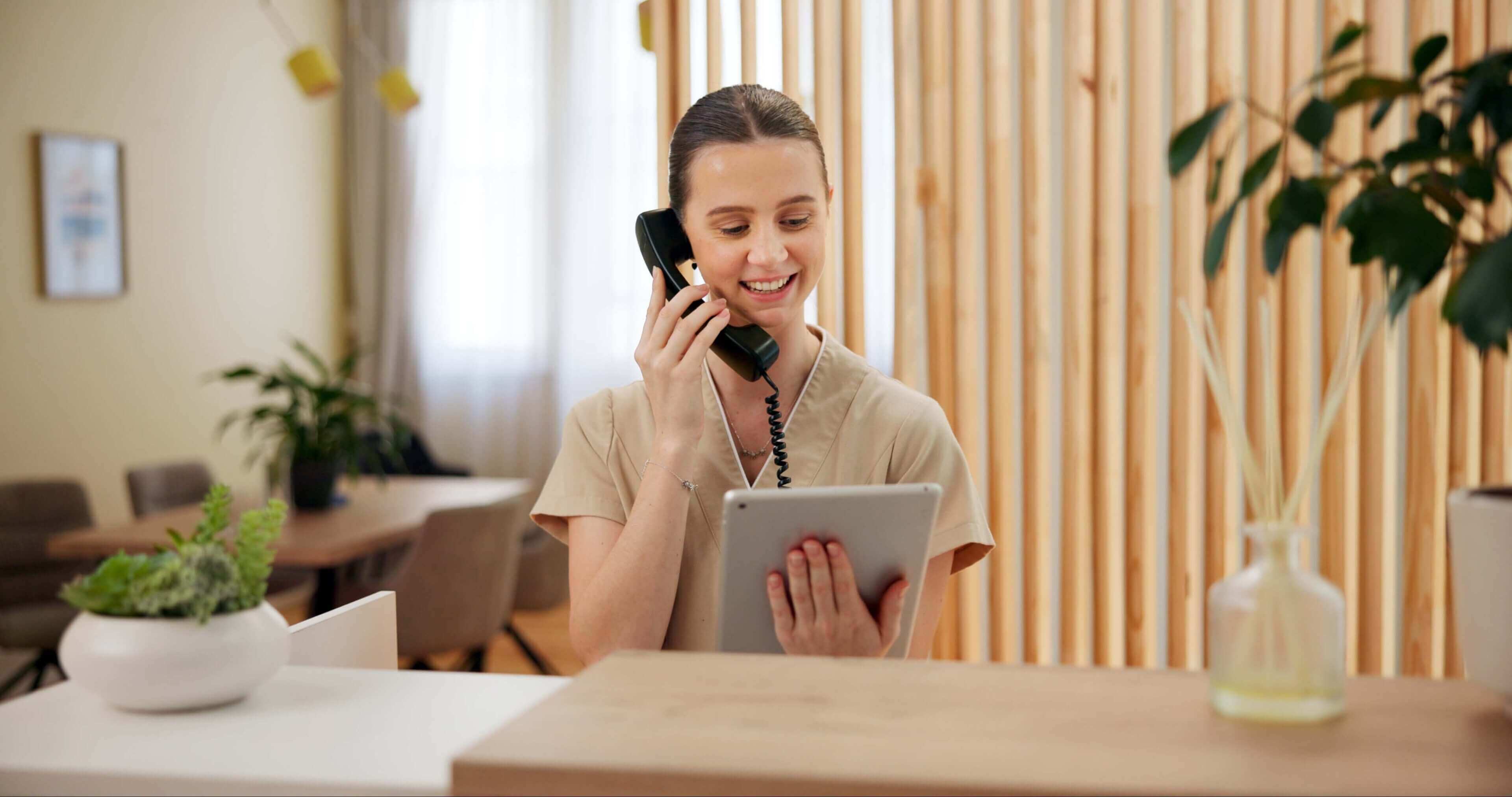 Woman multitasking with phone and tablet.