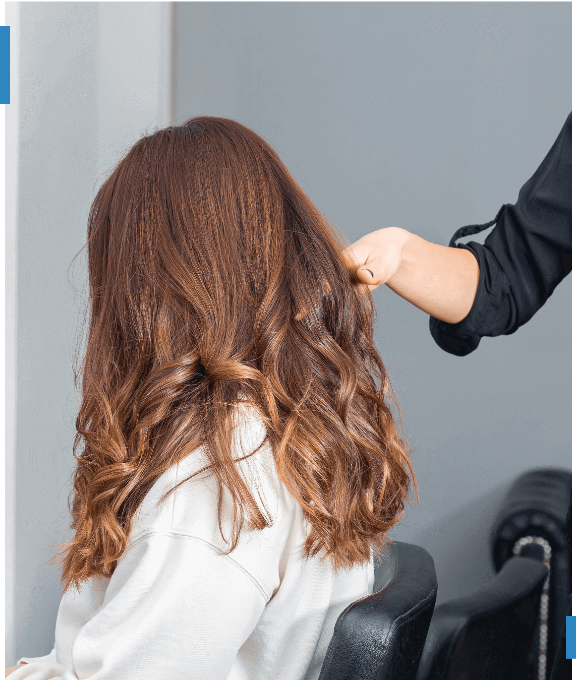 Woman with styled hair in a salon.