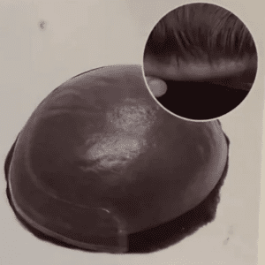 Toupee with inset of hair application.